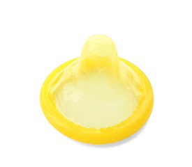 Yellow condom on white background. Safe sex concept