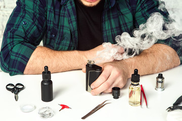 Master repair ecigarette on the white table