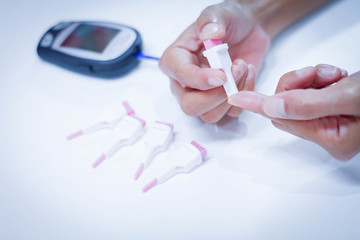 woman monitor blood glucose levels