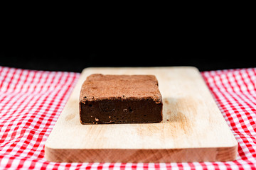 Chocolate Brownie cake on a dark plate