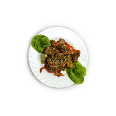 Grilled veal steaks with vegetables and sauce isolated on white background.