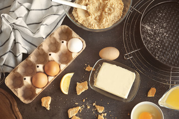 Ingredients for delicious cheese cake on kitchen table