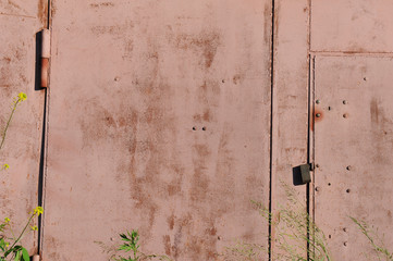 Pink metal texture with scratches and cracks