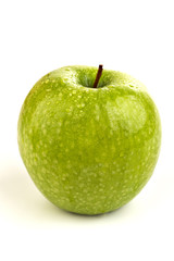 Bright ripe green apple in water drops