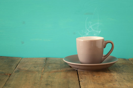 Image of coffe cup on wooden table