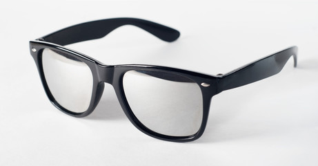 Sunglasses with a reflective surface on white background