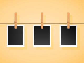 Trendy Set of empty photo frames on a rope with wooden clothspins pegs isolated on background. Vector design to use with your own photos and images