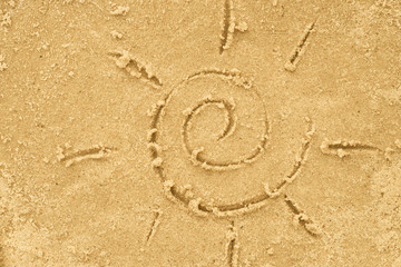 Fototapeta na wymiar sun drawing in sand