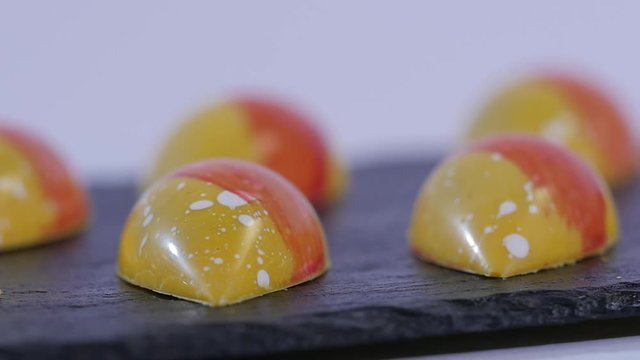Colorful candies close up. Set of colorful lollipops. Red and yellow Christmas candy. Slow motion