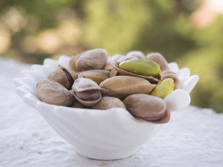 Pistachio nuts isolated in plates