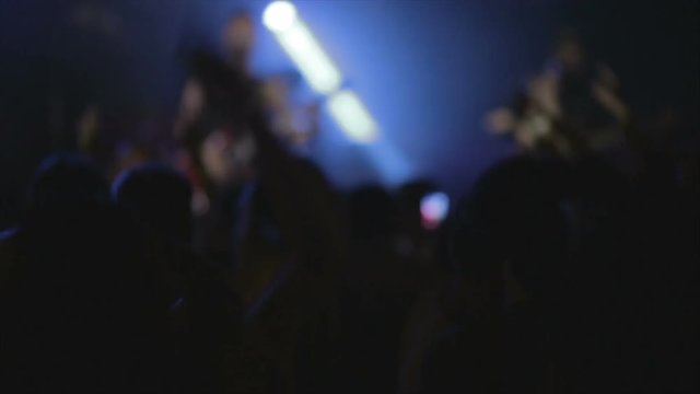 Footage of a crowd partying at a rock concert or dj party  slow motion