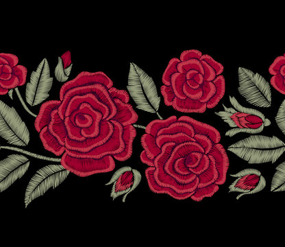 Red roses and green leaves. Embroidery flowers. Seamless border. Vector floral print.
