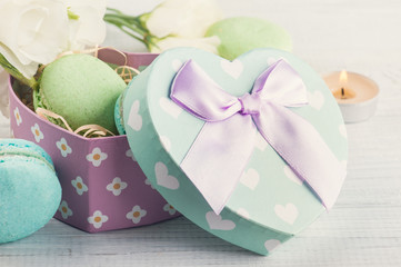 Pastel green gift box and macaroons