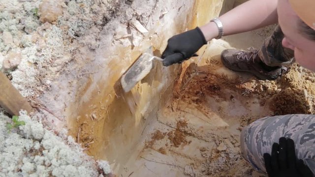 Archaeology - sweep the walls of the excavation