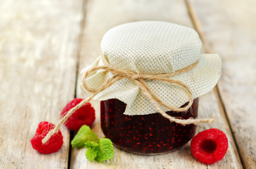 Raspberry jam with mint and fresh raspberries