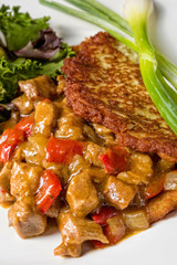 Hungarian goulash with potato pancakes
