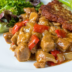 Hungarian goulash with potato pancakes