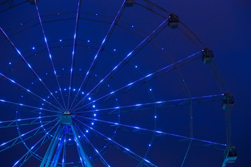Carnival ride showing a spinning ferris wheel in action