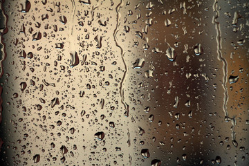 Raindrops on window glass , rainy day