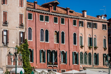 Venice - city in northeastern Italy, capital of Veneto region. Lagoon and a part of city are listed as World Heritage Site. Beautiful architecture of old houses in Venice. Italy.
