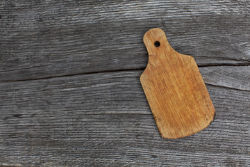 vintage cutting board on old wooden background