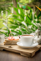 Coffee cup and sandwiches