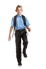 Boy with schoolbag marching