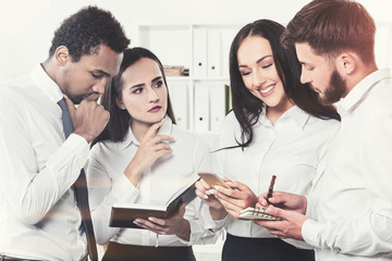 Diverse business team members brainstorm