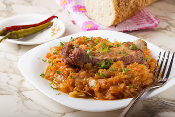 Cabbage stew with Smoked Pork Ribs and pickled chili peppers and bread