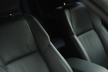 New car interior passenger driver seats leather details