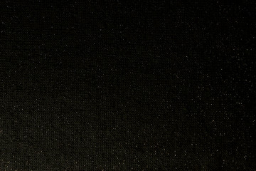 Black cloth  texture with lurex sparks.Abstract background