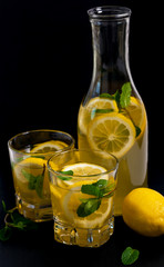 Lemon Lemonade Drink on Black Background. Selective focus.