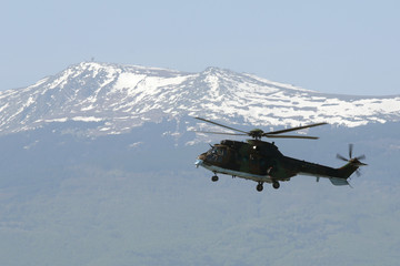 Fototapeta na wymiar Military helicopter mountain