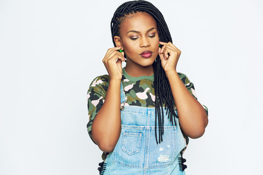 African-American Woman In Casual Clothes Touching Ears