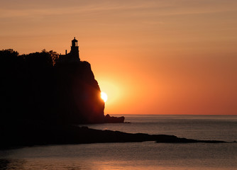 Naklejka na ściany i meble lighthouse at sunrise