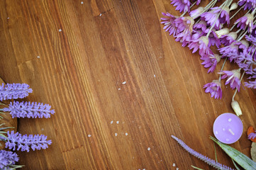 Wooden background with copy space for text and fresh meadow herbs