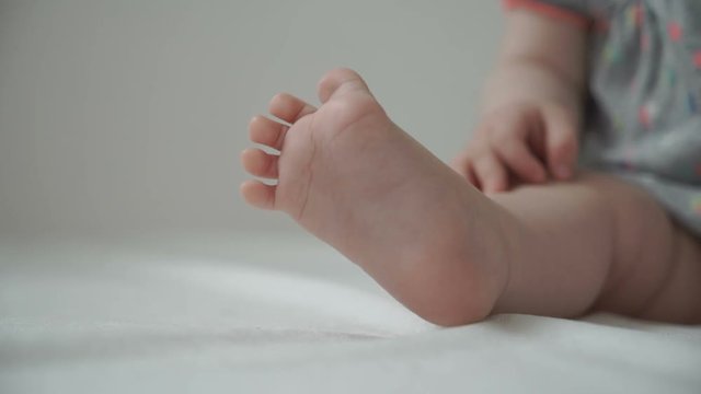 Small feet of the baby