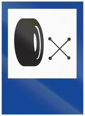 Tire shop informational road sign in Argentina