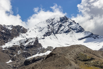 Weather event. Convective clouds in mountain.  Hiking trail towards Tersiva summit. Aosta Valley, Italy