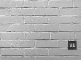 white brick wall background with light switcher