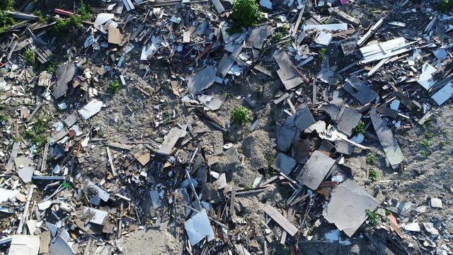 Aerial top down view of landfill site drone camera tilting down showing the garbage dumped in the waste disposal ready for recycling cyclus by solid waste management program 4k high resolution