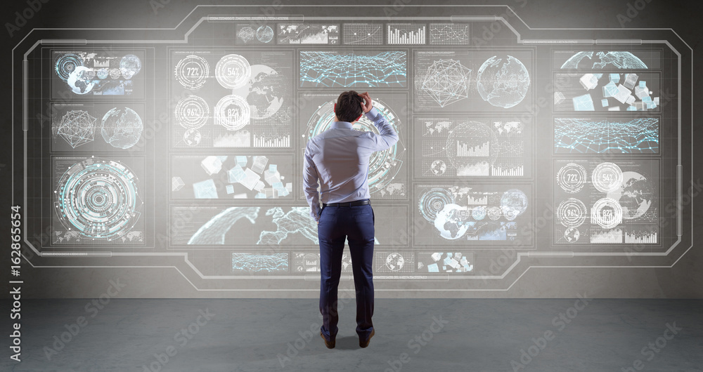 Poster Businessman using graph screens interface on a wall 3D rendering