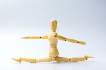 Wooden figure doll with Stretch arms and leg on white  for exercise training and helth concept