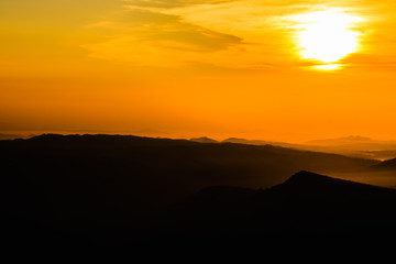 colorful sunrise in the mountain. Silhouette background.