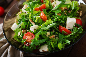 Vitamin Salad of fresh vegetables, herbs, feta cheese and nuts. Dietary menu. Proper nutrition.