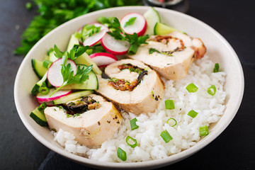 Healthy salad with chicken rolls, radishes, cucumber, green onion and rice. Proper nutrition. Dietary menu.