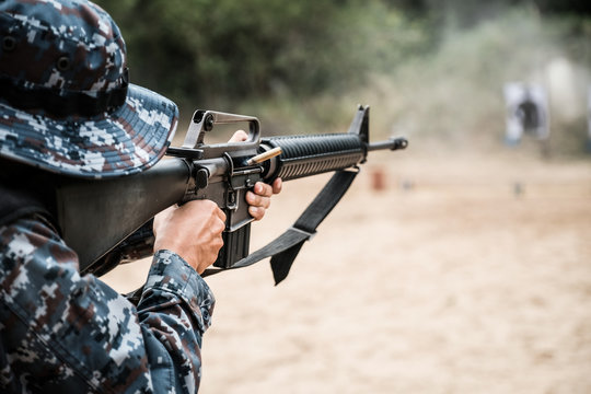 Thai soldier shooting rifles at firing range