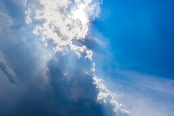 Beautiful blue sky with clouds and Sun rays