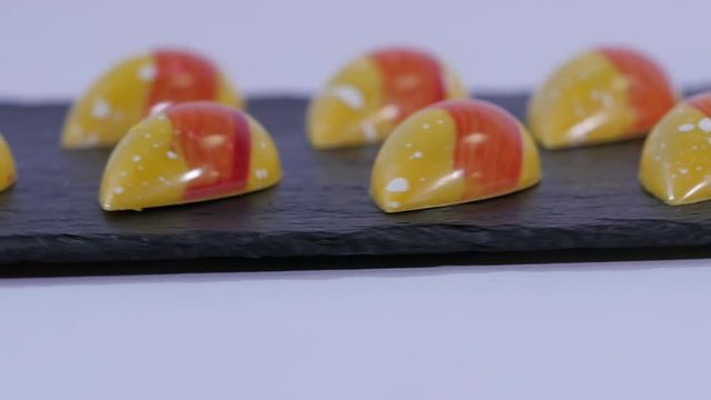 Colorful candies close up. Set of colorful lollipops. Red and yellow Christmas candy. Slow motion