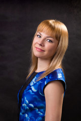Fototapeta premium Portrait of a girl in a blue dress